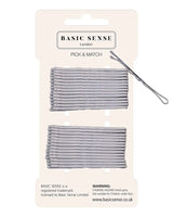 Metal bobby hair pins and scissors package close up