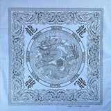 Square bandana with dragon design in 100% cotton.