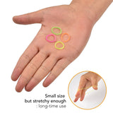 Extra strong mini rubber band on hand in versatile hair styling product.