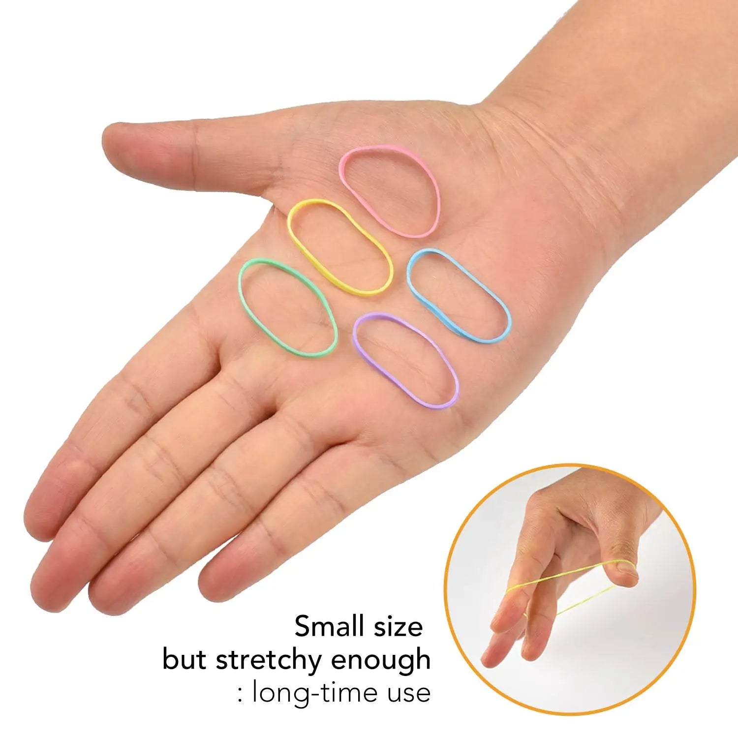 Close up of person holding scissors, extra strong mini rubber bands for versatile hair styling.