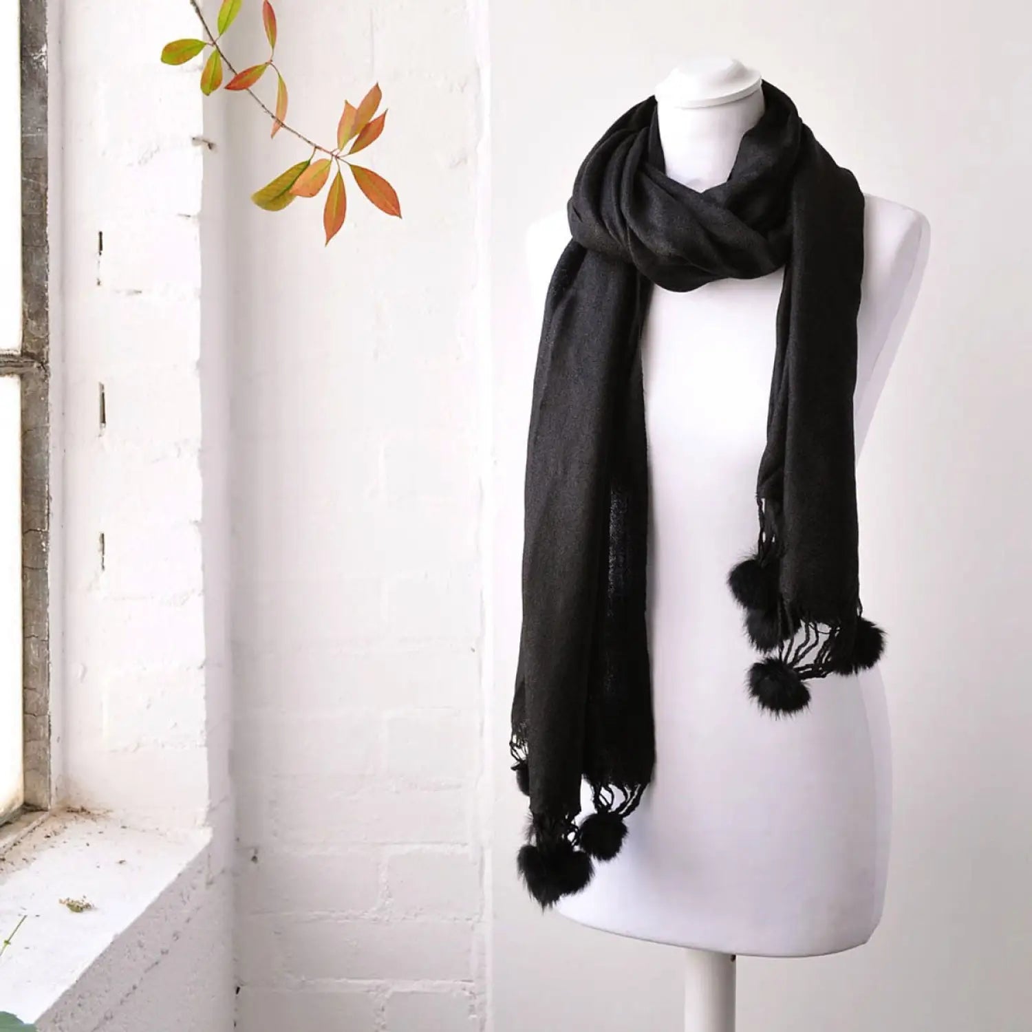 Faux Fur Pom Pom Pashmina Winter Scarf on Mannequin with Window Background