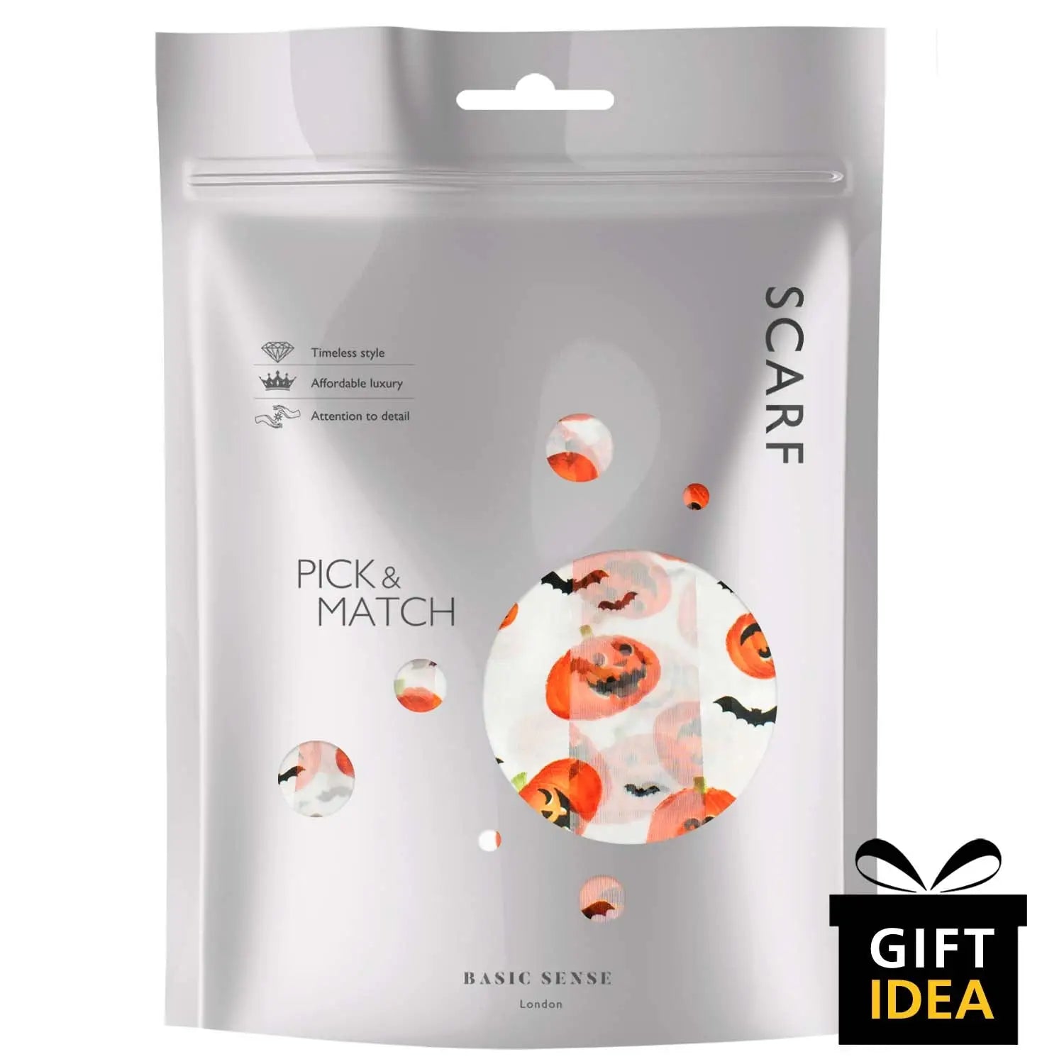 Halloween-themed pick and mix candy in a bag displayed with a Halloween Pumpkin & Bat Silky Satin Striped Scarf.