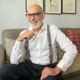 Man with beard and glasses sitting on couch wearing Mens 35mm Y-Shape Wide Leather Braces