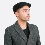 Men wearing black paperboy flat cap and jacket