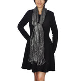Woman in black coat and scarf wearing Metallic Aztec Print Oversized Tasselled Scarf