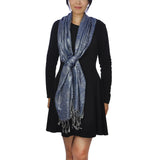 Woman wearing blue Aztec print scarf.