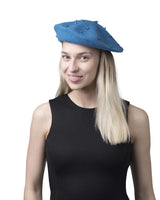 Woman wearing Parisian Classic Beret with Imitation Pearl Embellishment.