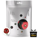 Red and black poppy floral print scarf & gold plated ring set on white background.