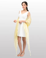 Woman wearing yellow shawl in Sheer Shimmer Evening Stole