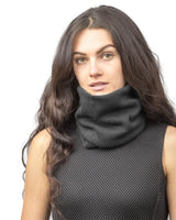 Woman wearing black turtle neck sweater.