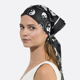 Close up of woman in ying yang print square bandana.