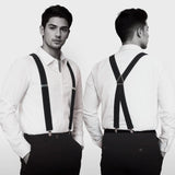 Front and back view of a man wearing classic black suspenders with silver clips. These adjustable Y back braces are shown over a white dress shirt. Ideal formal accessories for weddings groomsmen prom or vintage style dapper outfits.