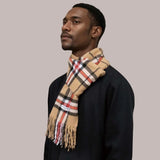 Woman in a plaid scarf from the Winter Warm Scarves collection of knitted scarves.