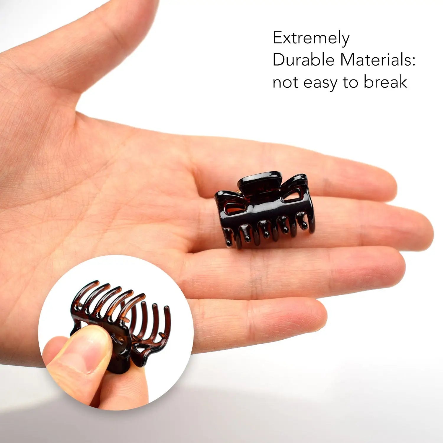 Essential Hair Claw Clips Set, 9pcs - 2.7cm: Hand holding black ring with black band
