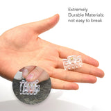 Small clear crystal cube held in hand, part of Essential Hair Claw Clips Set.