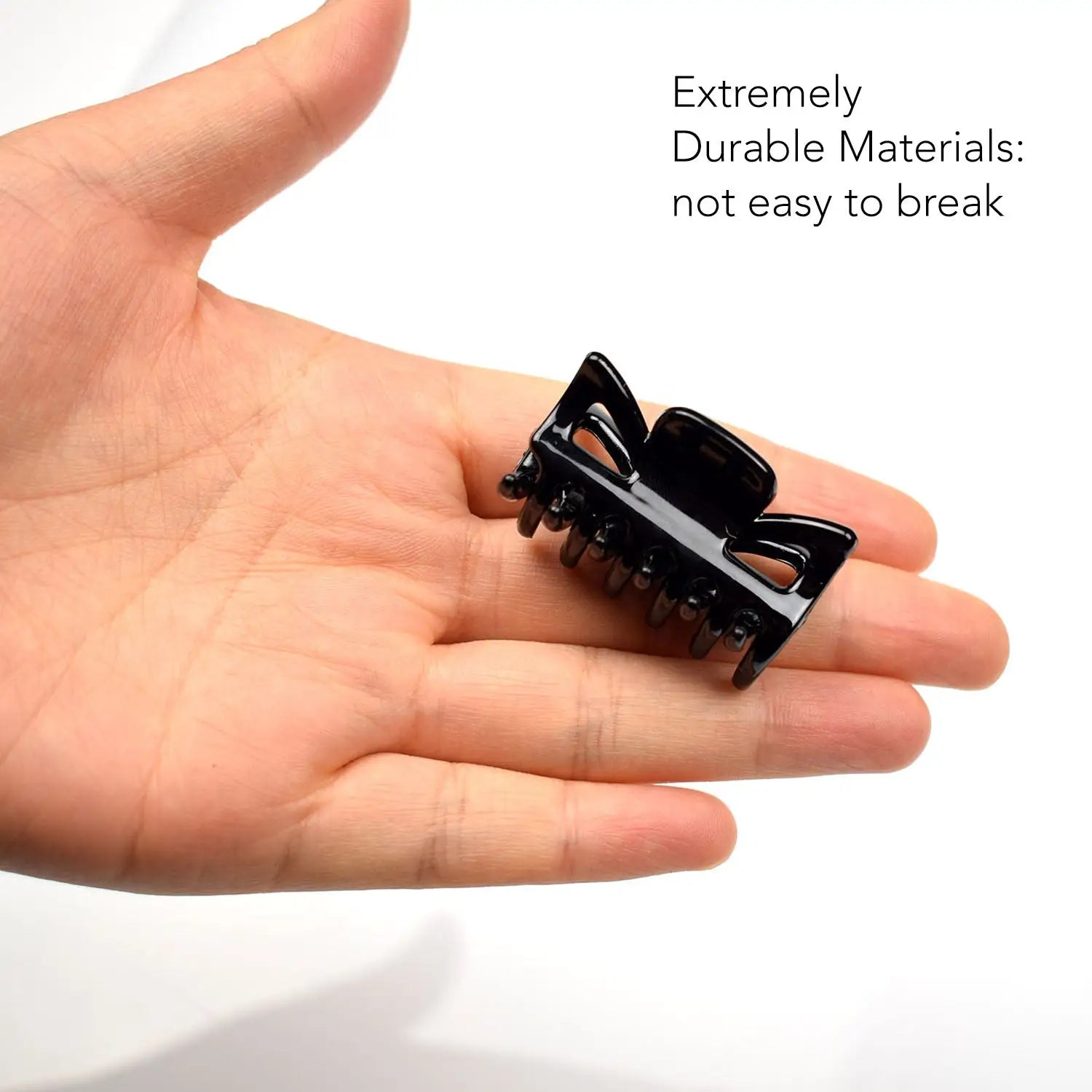 Essential Hair Claw Clips Set, 6pcs - 4cm: Hand holding black toy car