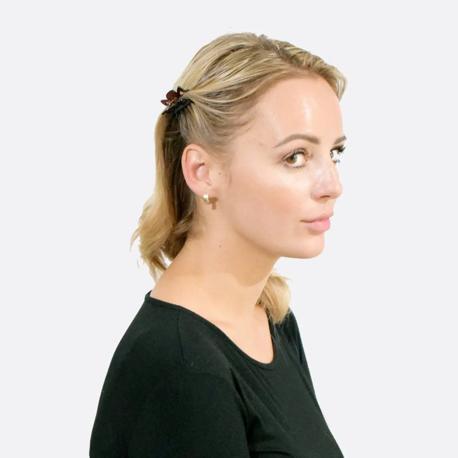 Blonde woman wearing black shirt with Essential Hair Claw Clips Set.