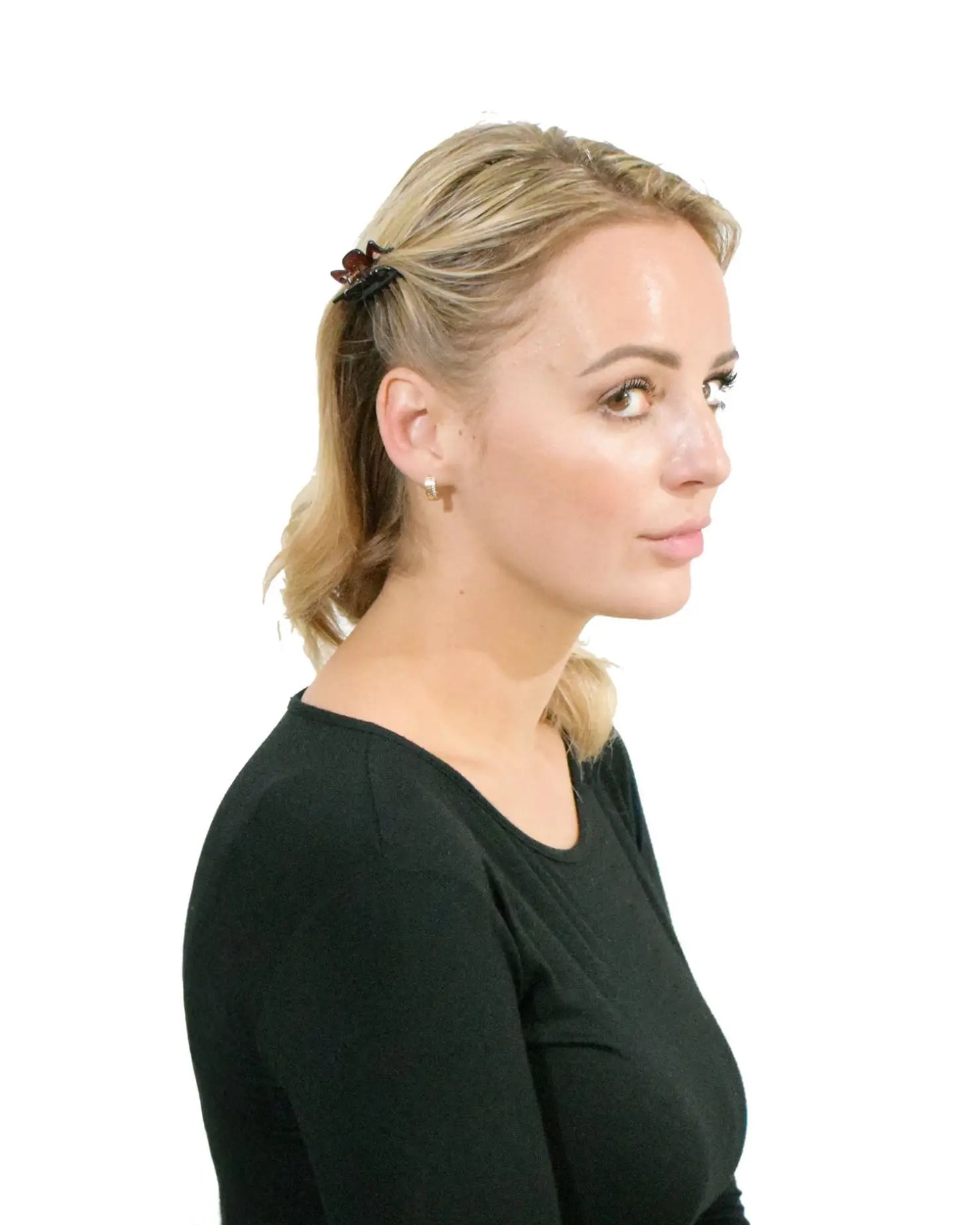 Blonde woman wearing black top with Essential Hair Claw Clips Set.