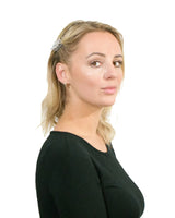 Blonde woman wearing black top demonstrating Essential Hair Claw Clips Set.