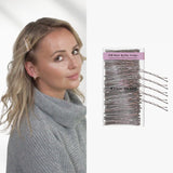 Close up of woman with hair comb and package of 120pc wavy Kirby metal bobby hair pins.
