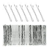 Close up of 120pc wavy kirby metal bobby hair pins on white background