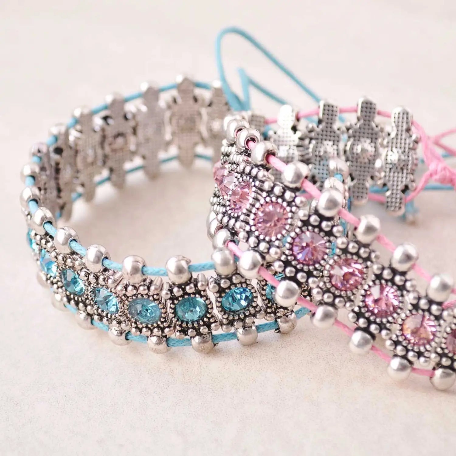 Boho rhinestone and elastic bead bracelets with silver, pink, and blue beads.