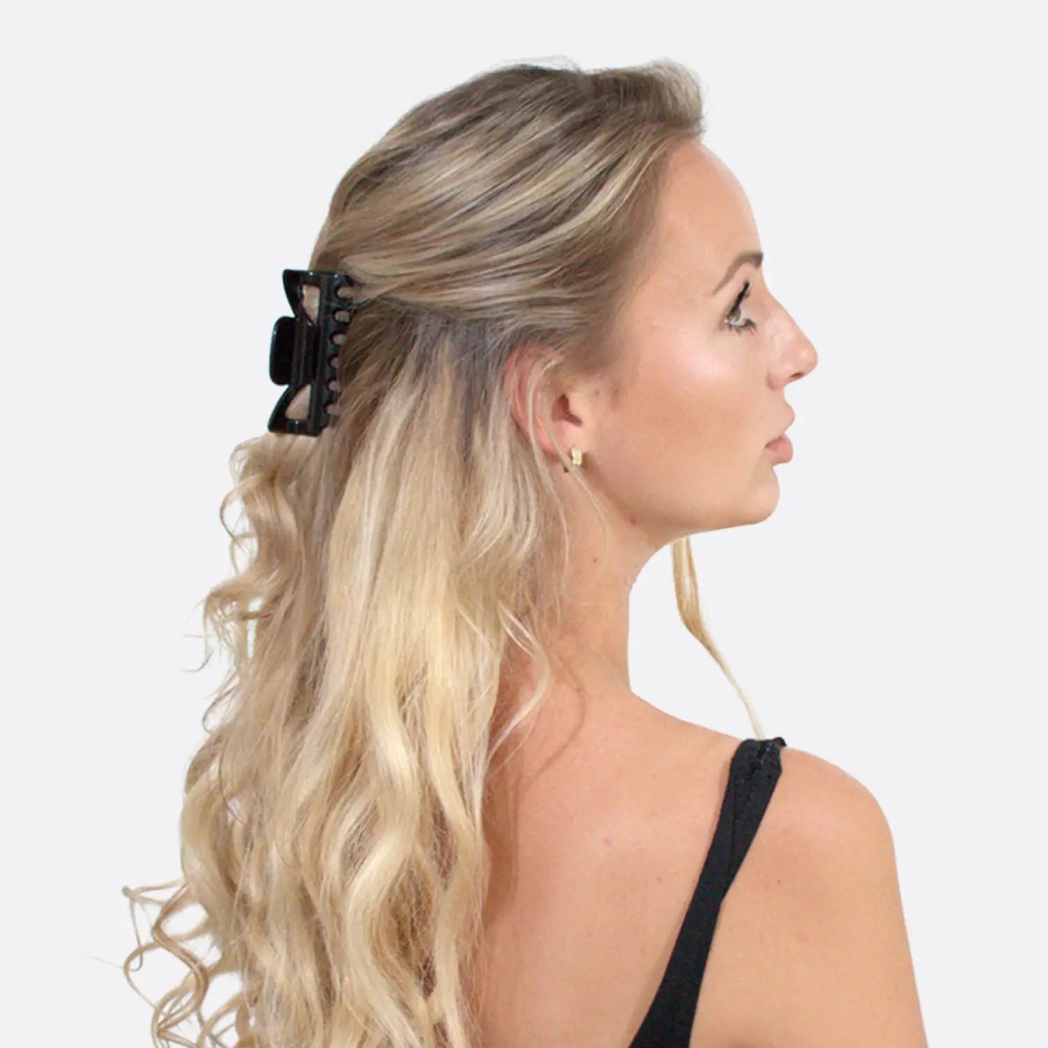 Blonde woman wearing black bow hair claw clips from Essential Hair Claw Clips Set