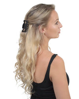Blonde woman wearing black bow in Essential Hair Claw Clips Set