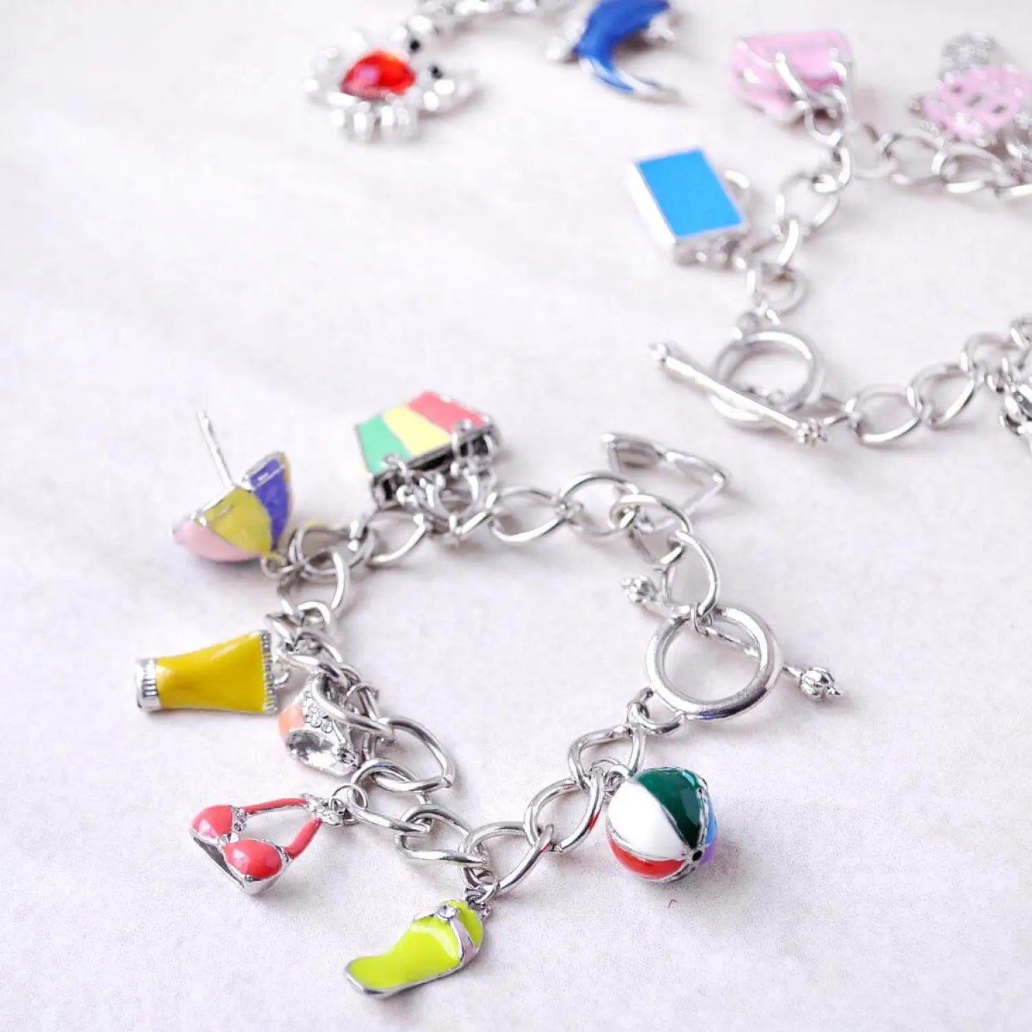 Colorful charm bracelet from 3 Pack Metal Charm Bracelets - Your Perfect Summer Accessory.