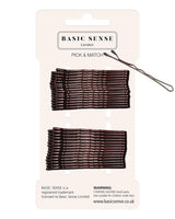 Metal bobby hair pins for hold & style on white background.