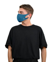 Man wearing copper-infused face mask with blue filter.