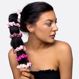 Woman wearing a pink flower hair tie scrunchie from 6 PCS Satin Hair Tie Scrunchies