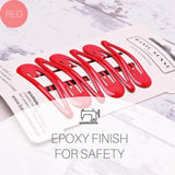 A red plastic fork labeled ’foxy finish safety’ in Epoxy Metal Hair Clips - 6pcs School-Ready Hairpins