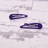 Two purple epoxy metal hair clips on white wooden floor - School-Ready Durable Hairpins