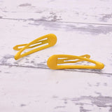 Two yellow metal hair clips on white wooden surface - Epoxy Metal Hair Clips, 6pcs