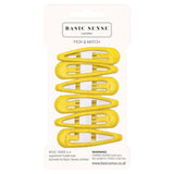 Close-up of bakne yellow plastic snaps on Epoxy Metal Hair Clips, School-Ready Durable Hairpins, 6pcs