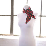 Black and red polka dot sash scarf on mannequin with matching hair pin set