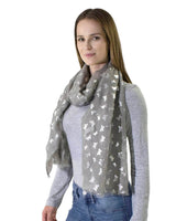 Woman wearing grey scarf with white stars on it from product Butterfly Print Silver Foil Oversized Scarf
