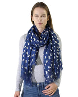 Woman wearing a butterfly print oversized scarf with silver foil in blue and white pattern