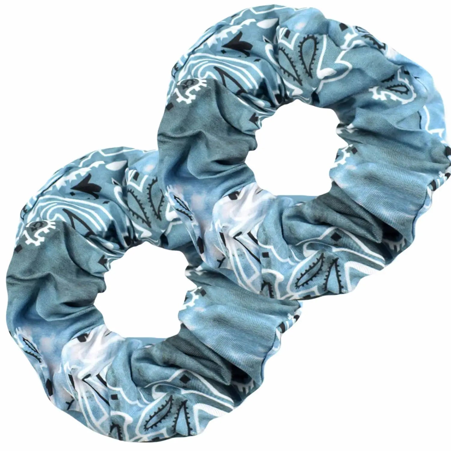 A close-up of a tie dye ombre grey hair scrunchie for women in daily use with black plain casual outfit