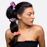 Woman with ponytail and flower wearing Acid Wash Tie-Dye Scrunchies: Set of 6 Retro Revival Pieces