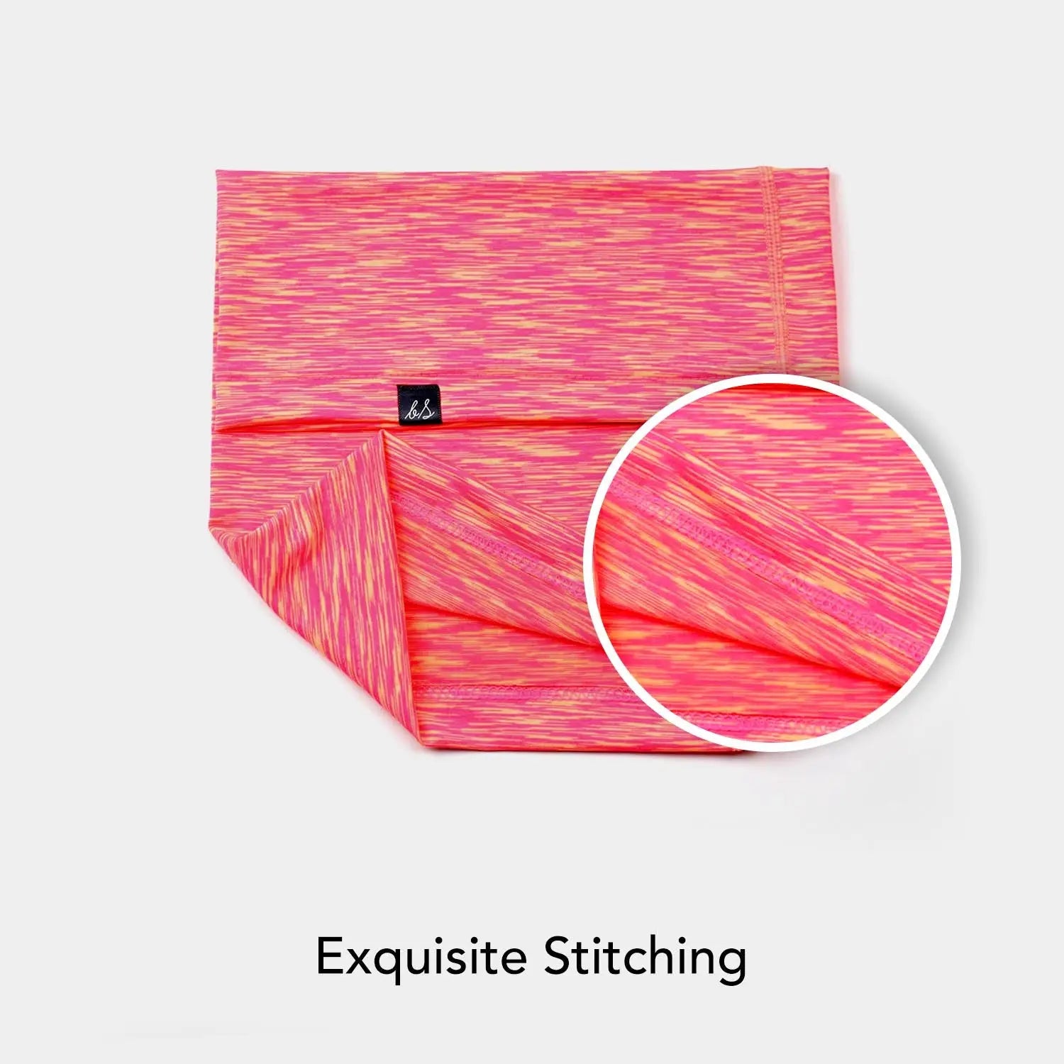 Pink and orange patterned yoga leggings with a black logo on Active Performance Neck Gaiter