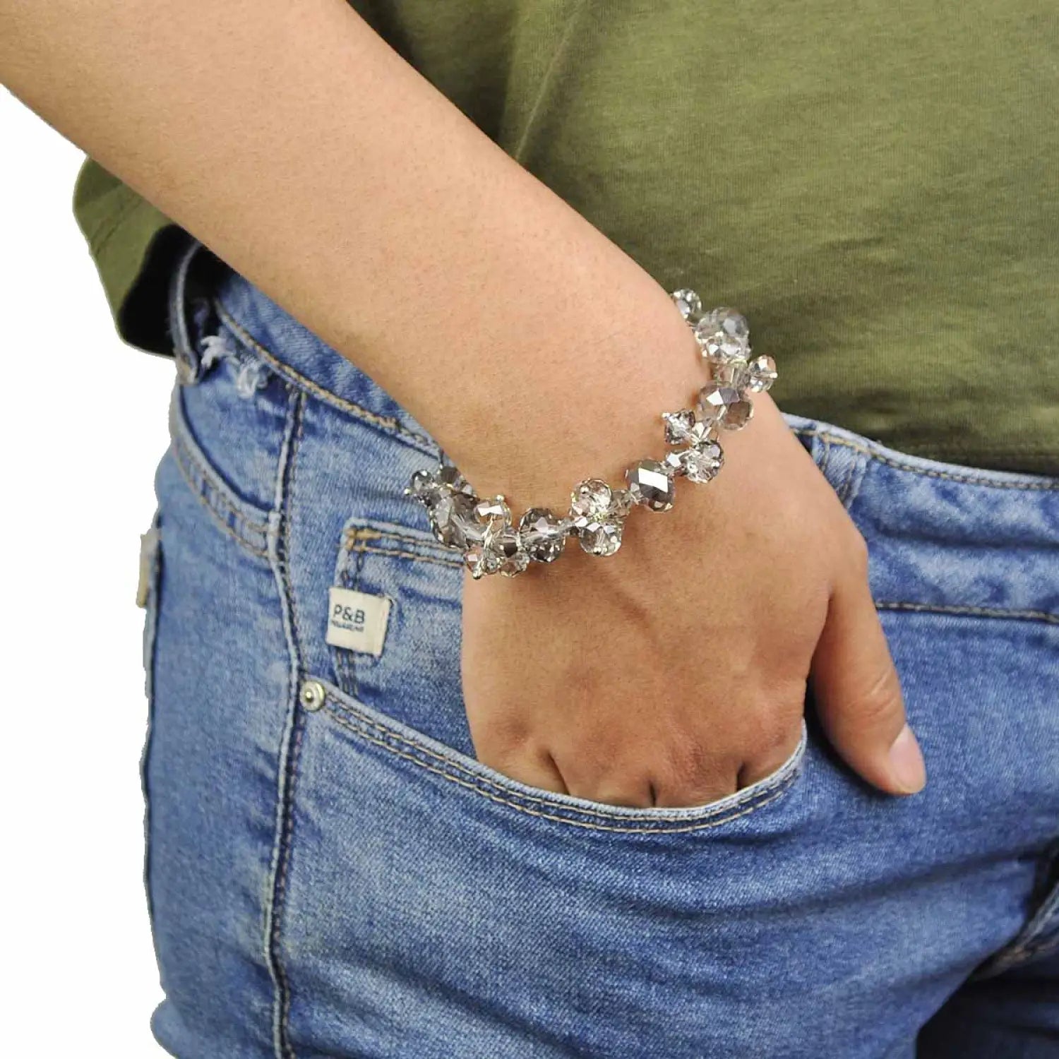 Woman wearing flower design bracelet with crystal glass beads.