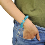 Woman wearing crystal glass beads bracelet with blue beads from Adjustable Crystal Glass Beads Stretch Bracelet for Layering Looks.