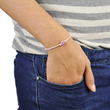 Adjustable Diamante Ball Friendship Bracelet with heart on pink cord.