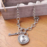 Antique silver necklace with heart gemstone and key charm