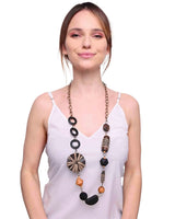 Woman wearing black and white wooden beads long necklace