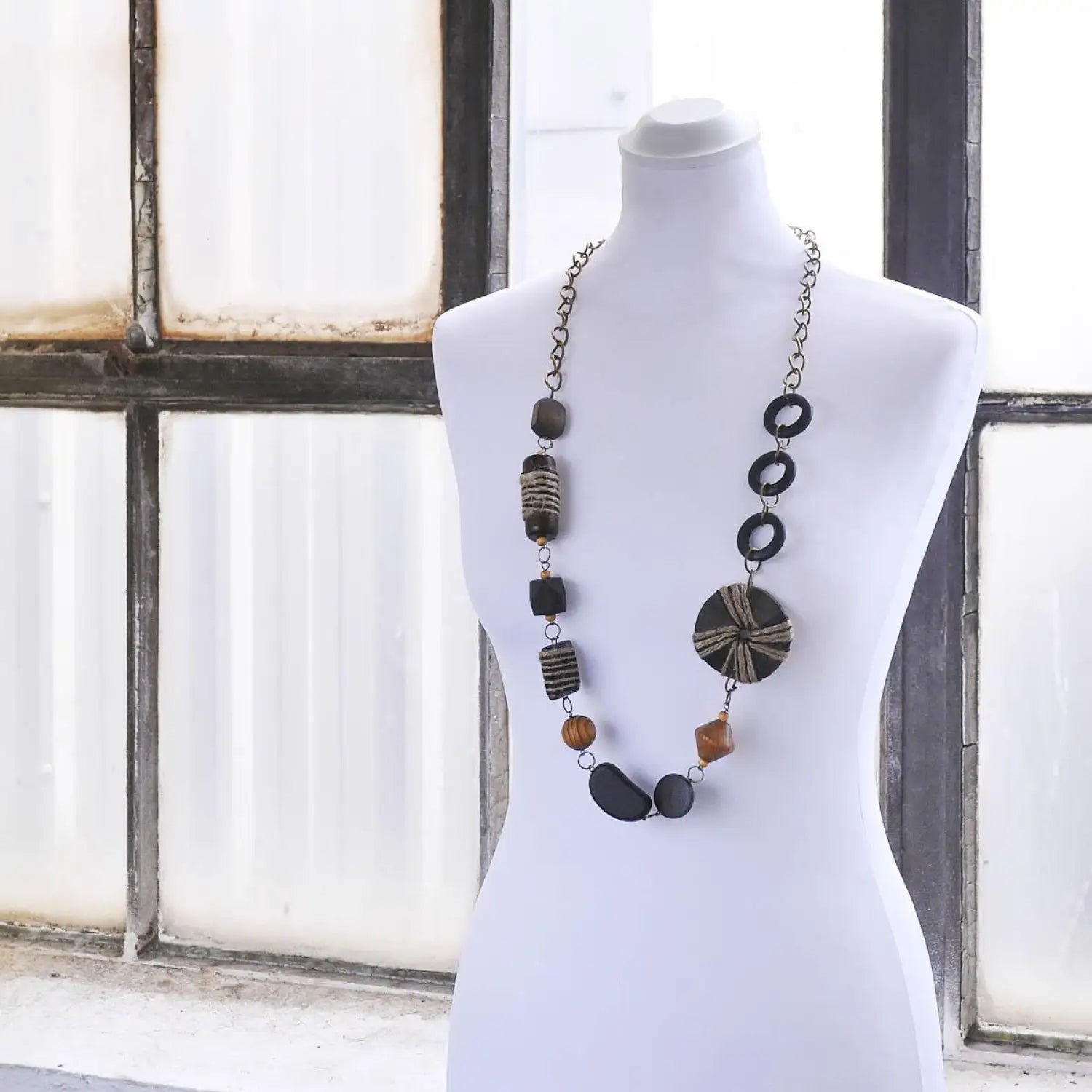 Art Patterned Wooden Beads Long Necklace main image: mannequin with necklace.