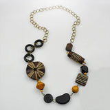 Art patterned wooden beads long necklace featuring a wooden bead and metal chain.