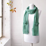 Shimmering Knitted Flower Scarf on Mannequin